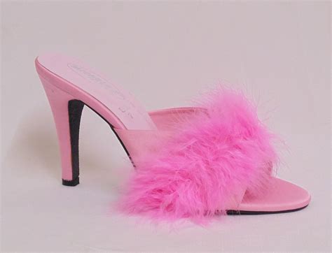 pink high heeled mules.